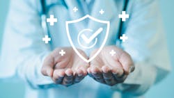 GMP Good Manufacturing Practice concept. Cupped hands hold digital medical approval symbol. GMP Good Manufacturing Practice concept. Cupped hands hold digital medical approval symbol.