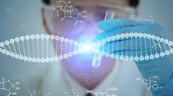 Gene therapy concept. DNA chain in foreground with scientist in background with test tube