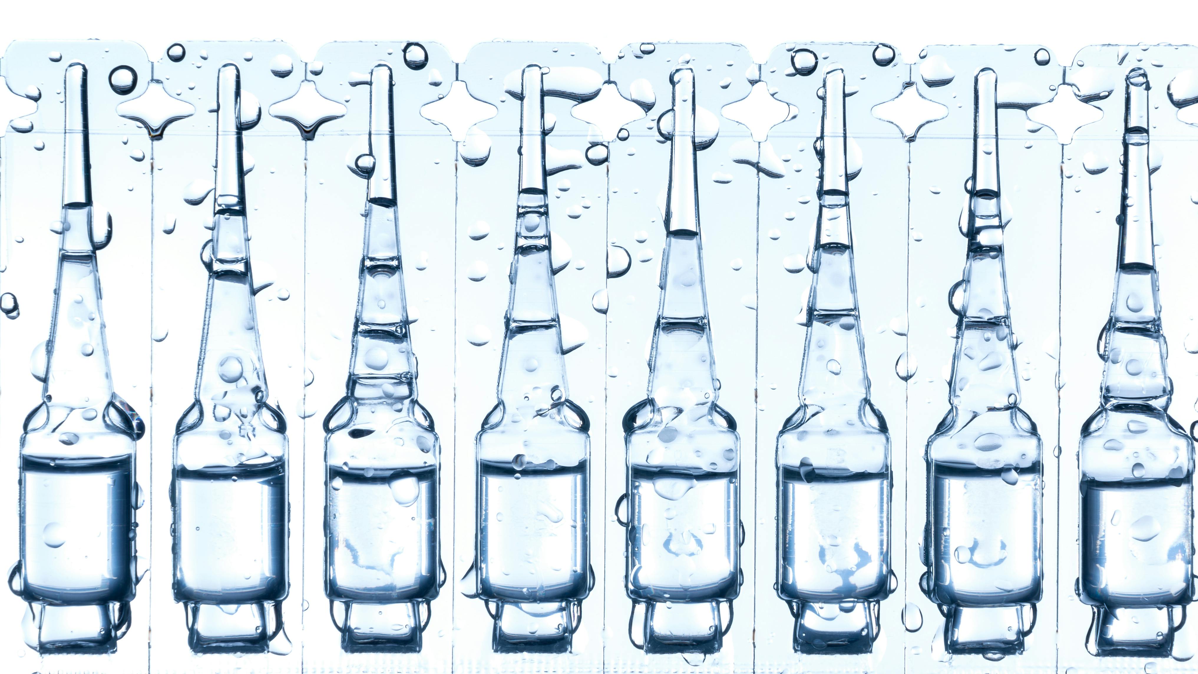 ampoule with a liquid for injection isolated on white; blow-fill-seal technology