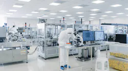 Shot of Sterile Pharmaceutical Manufacturing Laboratory where Scientists in Protective Coverall's Do Research, Quality Control and Work on the Discovery of new Medicine