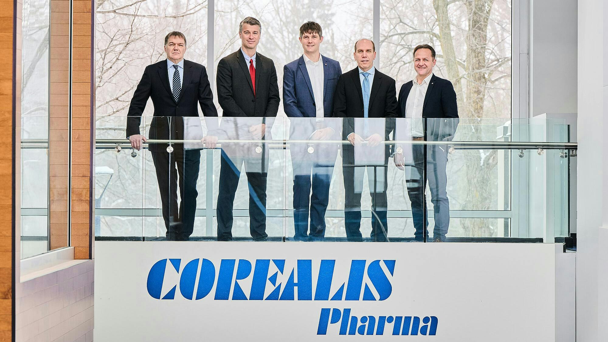 Standing together are Yves Mouget (Vice President Analytics, Corealis Pharma), David Leroux-Petersen (CEO, Corealis Pharma), Dr. Eike Cordts (Director Early Stage Development USA), Patrick Gosselin (Vice President Pharmaceutical R&D, Corealis Pharma) and Erich Scheibner (Managing Director)