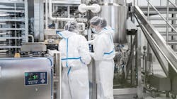 Two workers in Lonza Bioconjugates facility in Visp, Switzerland Two workers in Lonza Bioconjugates facility in Visp, Switzerland