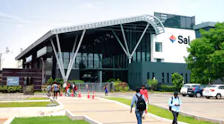 Workers walking outside to and from Sai Life Sciences building in Hyderabad, India