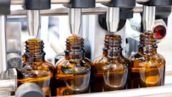 Bottles on the production line conveyor of the pharmaceutical industry. Machine for liquid drugs glassware bottling. Bottles on the production line conveyor of the pharmaceutical industry. Machine for liquid drugs glassware bottling.