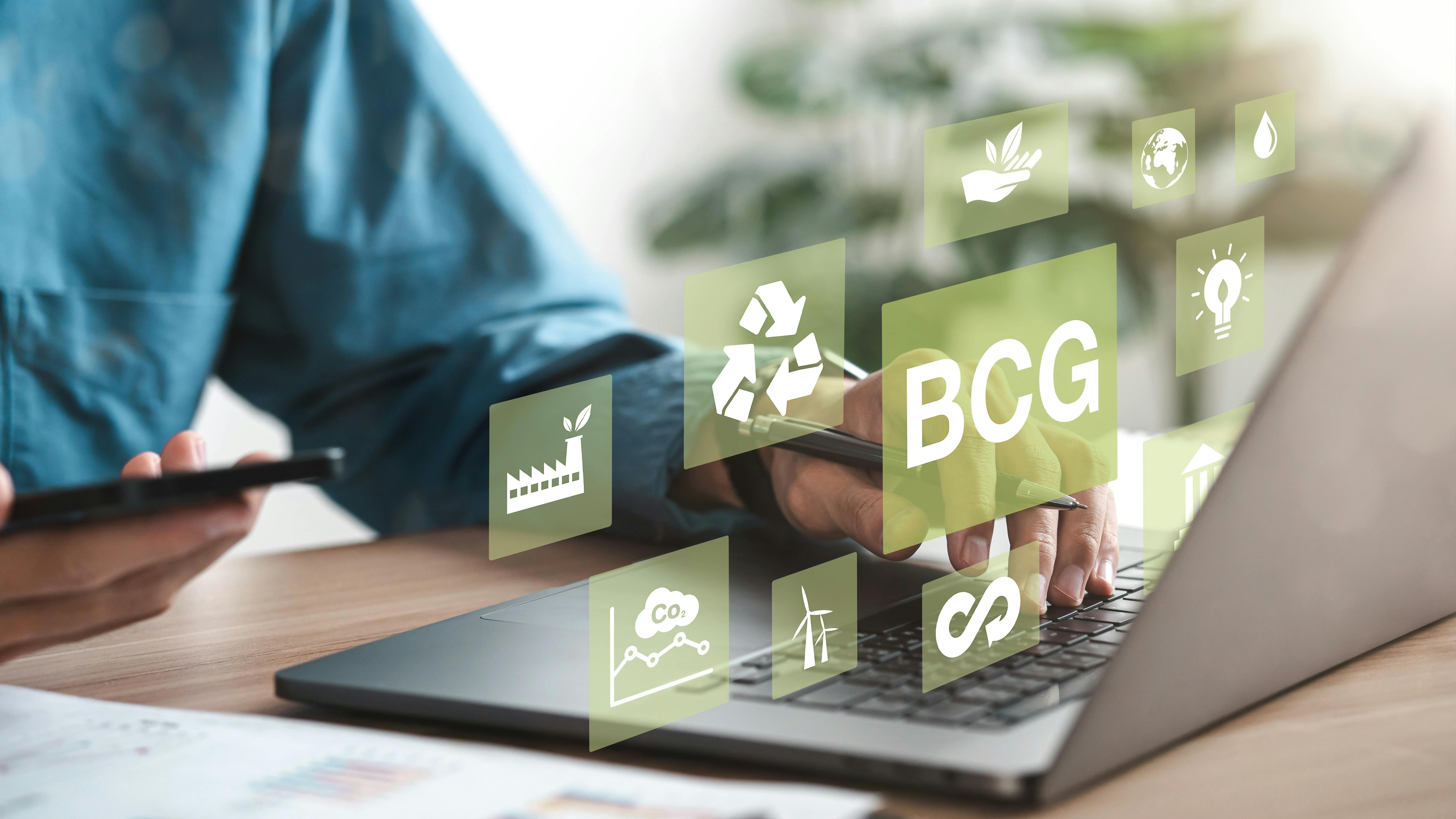 Businessman using computer to study BCG for sustainable economic development. BCG concept, bioeconomy, circular economy, green economy. with an icon on the screen