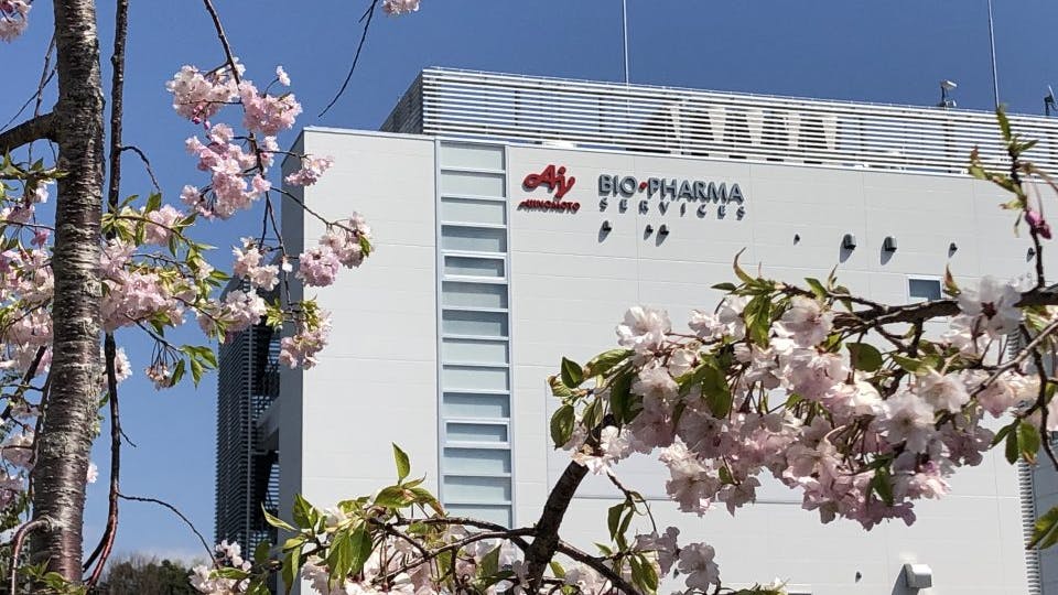 Ajinomoto Bio-Pharma logo on building in Japan