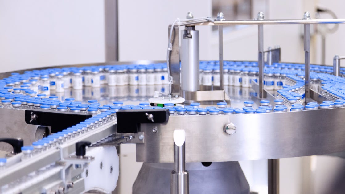 Rows of bottles on a pharmaceutical packaging line