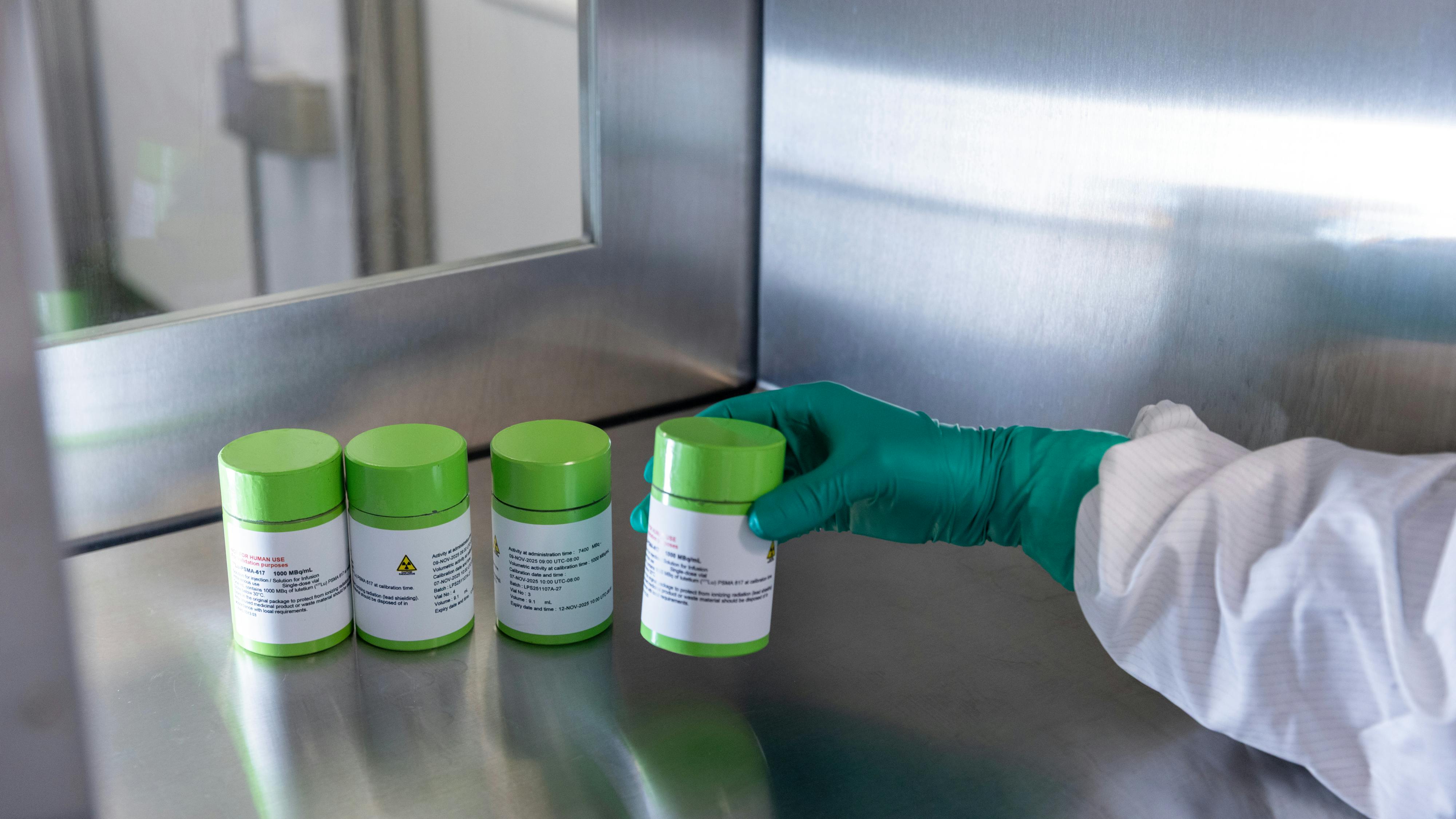 Lead-shielded canisters contain radioligand therapy doses.