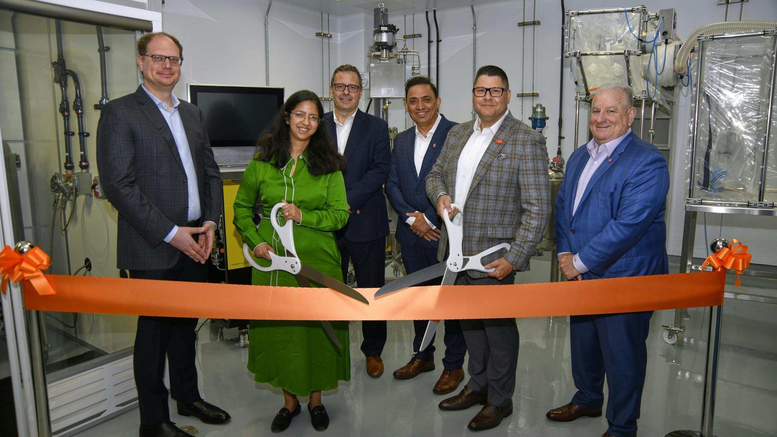 Ribbon cutting at Piramal Pharma Solutions&rsquo; payload-linker suite, Riverview, MI. Left to right: Peter DeYoung, CEO, Piramal Global Pharma; Nandini Piramal, Chairperson, Piramal Pharma Limited; Herve Berdou, COO, PPS; Manoj Zalpuri, EVP North America Operations, PPS; Bruce Guimares, VP & Site Head, PPS; Stu Needleman, CCO, PPS.