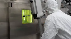 Radiopharmaceutical worker in protective gear Radiopharmaceutical worker in protective gear