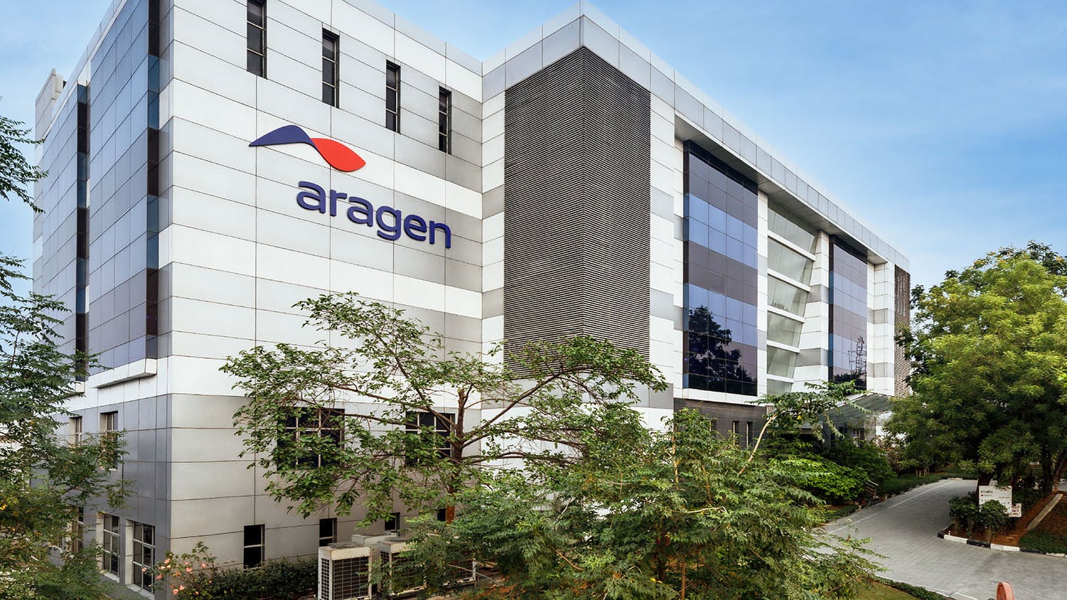 Exterior of Aragen facility with company logo on building
