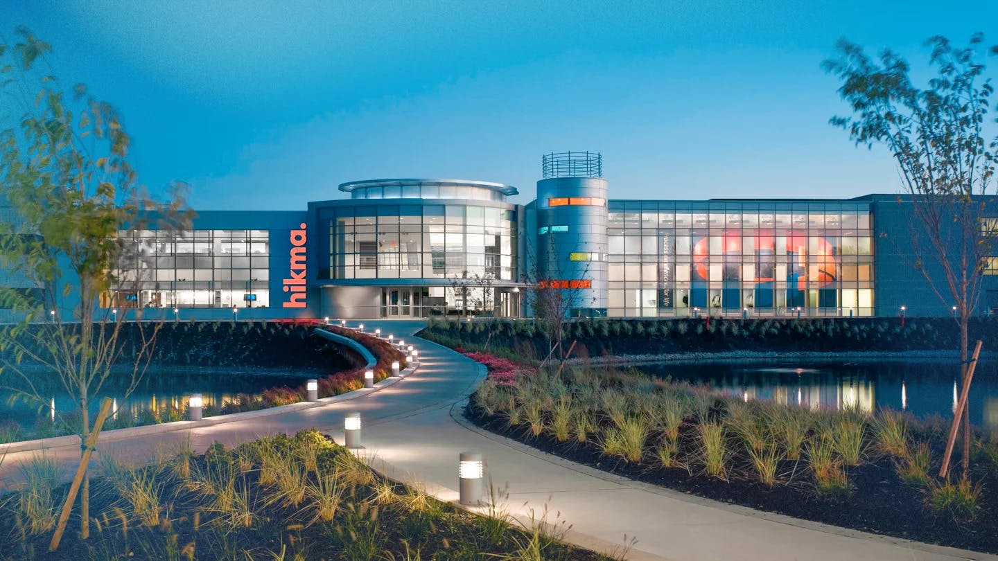 hikma building at dusk in Ohio with lighted sidewalk path in foreground