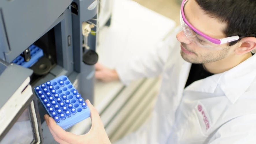 Overhead view of Evonik worker assisting with amino acid development