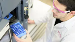 Overhead view of Evonik worker assisting with amino acid development