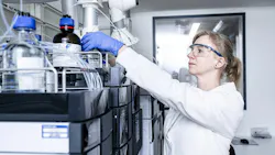 ProBioGen scientist in front of pharma equipment