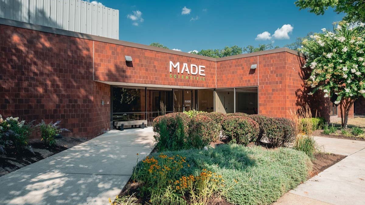 Exterior view of brick building with Made Scientific logo