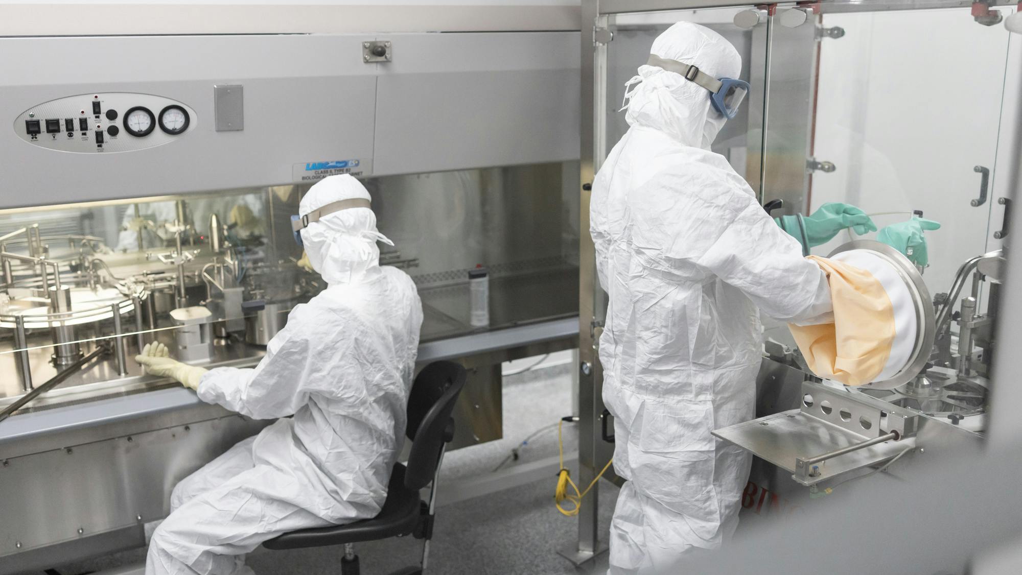 Pharma workers in full PPE at Evonik facility