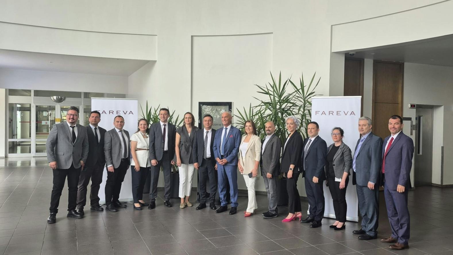 Fareva executives pose in lobby of new pharma facility in Turkey