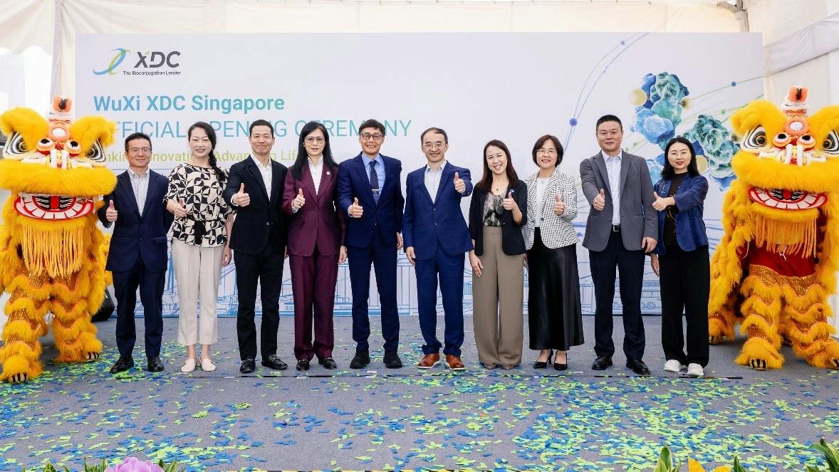 Executives pose during WuXi XDC Singapore opening ceremony