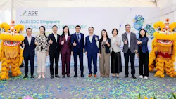 Executives pose during WuXi XDC Singapore opening ceremony