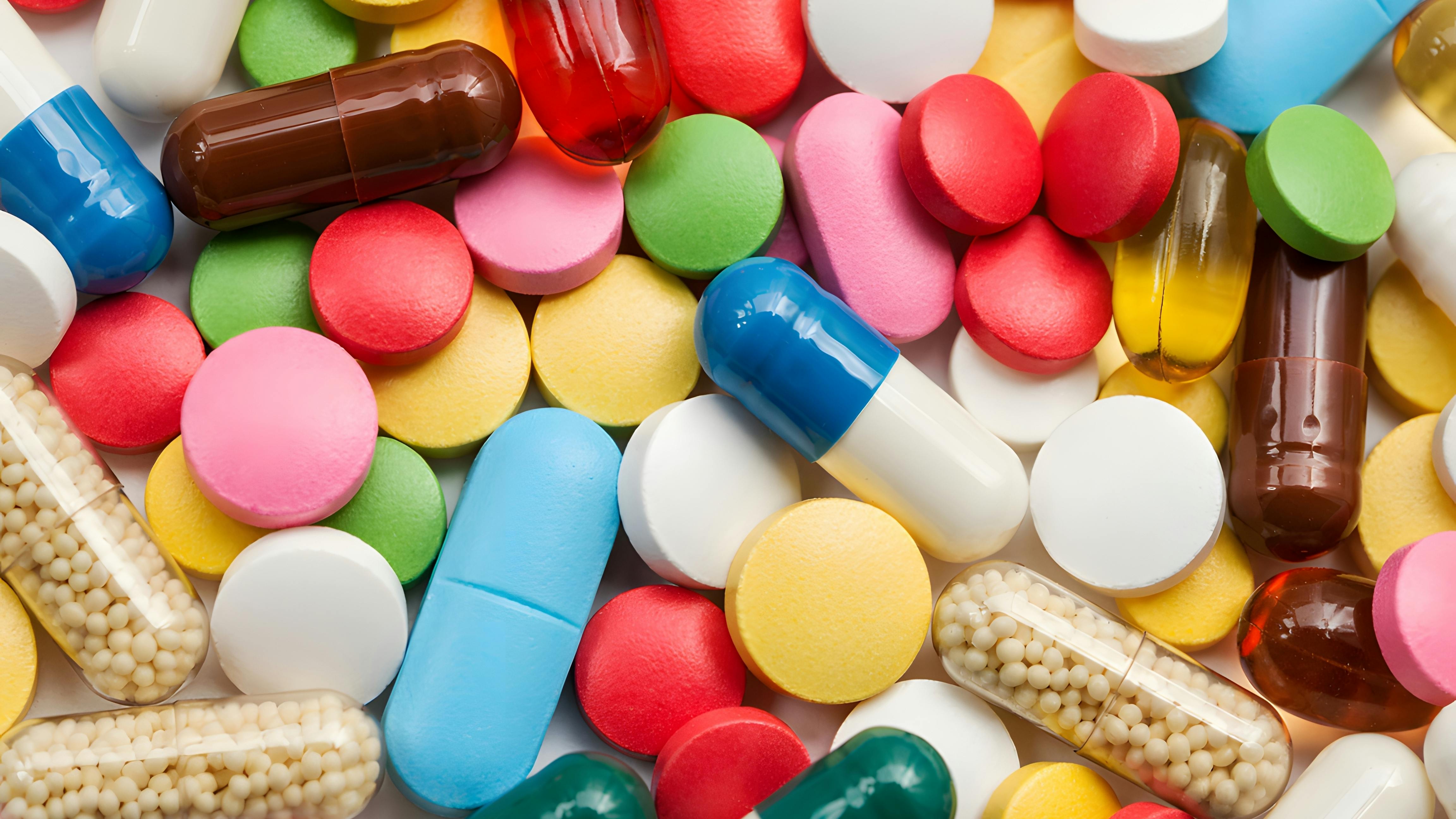 Pile of various colorful pill tablets