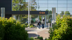 Two women walk near GSK campus in Upper Merion Township, Pennsylvania