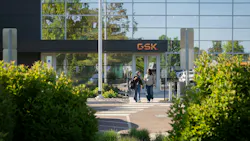 Two women walk near GSK campus in Upper Merion Township, Pennsylvania